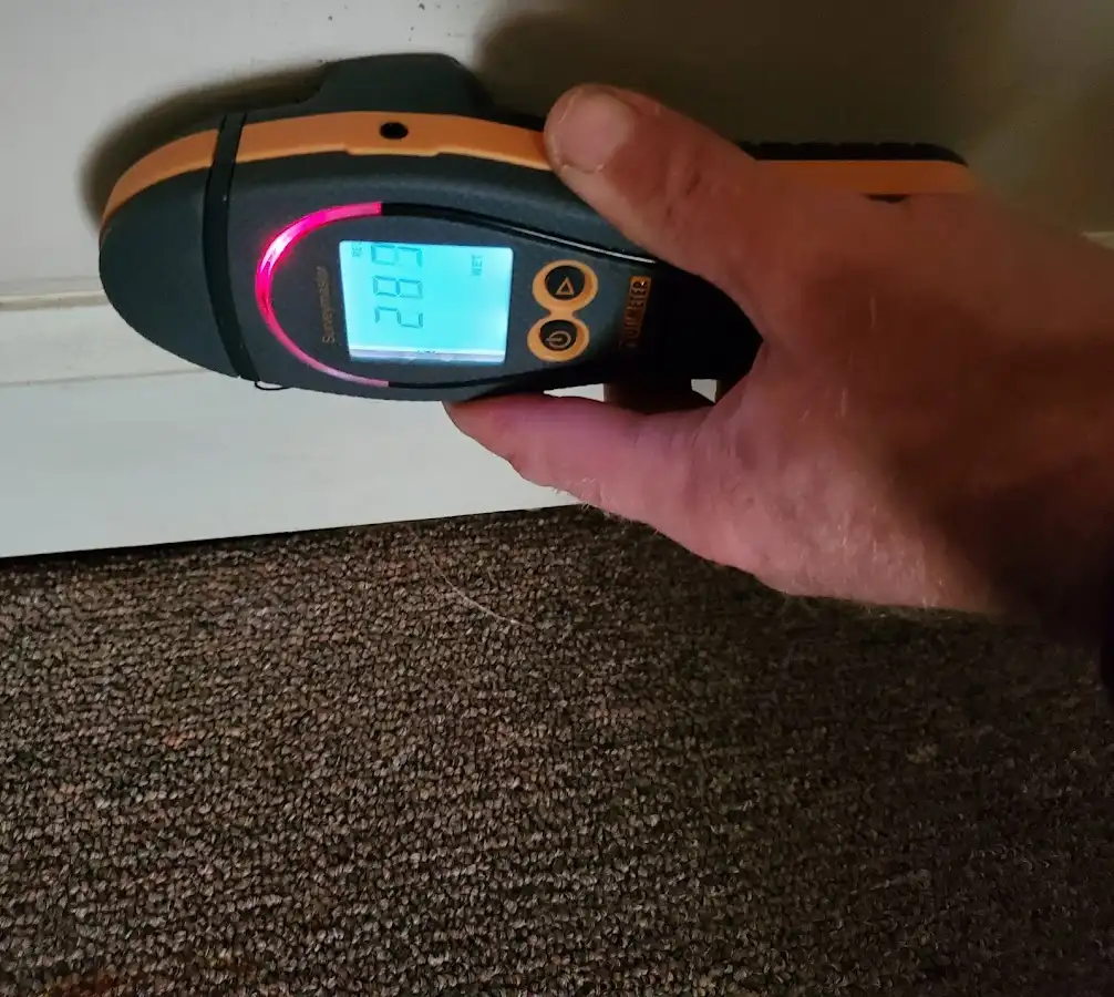 Moisture detection at baseboard during Storm Damage Restoration in South Strabane